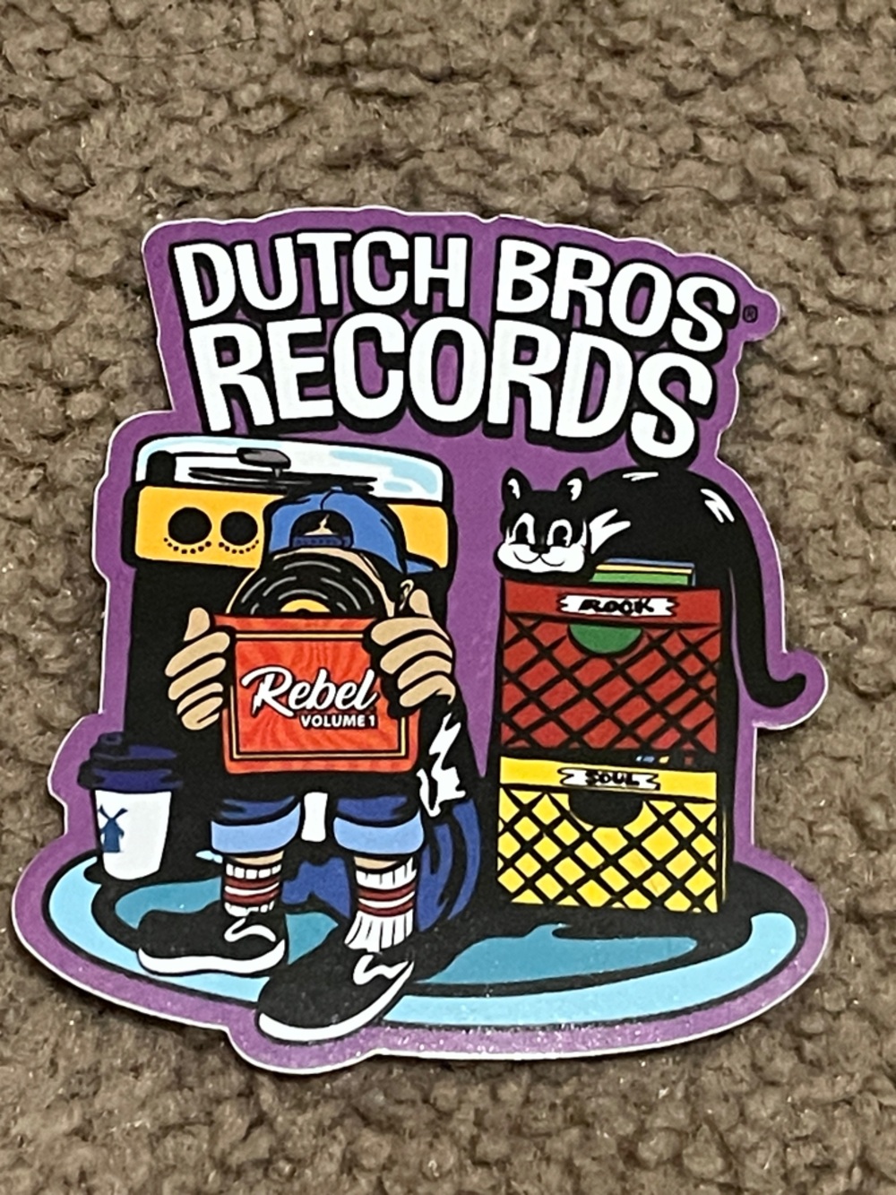 Dutch Bros Records Purple Sticker with Black, Red, Yellow, Blue, White Accents